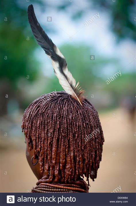 Rear View Of Hamar Tribe Woman With Traditional Hairstyle And Feather Turmi Omo Valley
