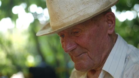 Very Old Man Portrait With Emotions Grandfather In White Hat Sad And