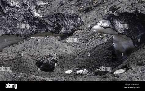Snow On The Etna Covered By Black Volcanic Soil Stock Photo Alamy