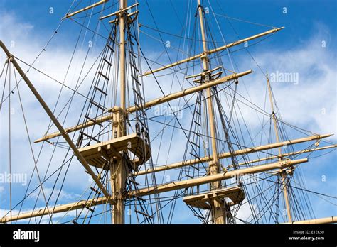 Masts And Rigging Of A Big Old Sailing Ship In Front Of A Blue Sky