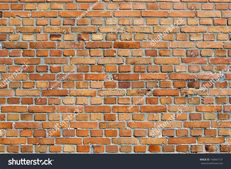 Orangey Red Face Brick Wall Background Texture Of Unpainted Clay Bricks