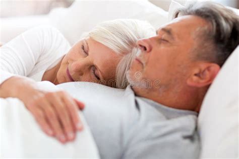 Senior Couple Sleeping In Bed Stock Photo Image Of Apartment Aging