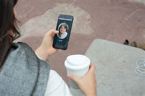 Premium Photo Woman Unlocking Smartphone With Facial Recognition Technology
