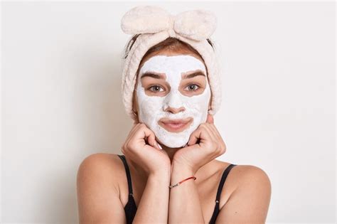 Premium Photo Adorable Young Female With White Facial Beauty Mask