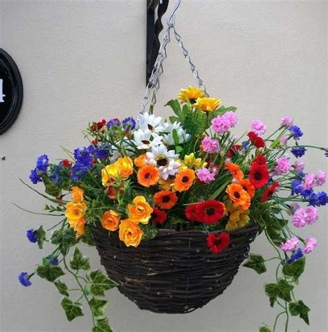 Keep the edges from yellowing by displaying. Pretty artificial hanging basket of wild flowers - The ...