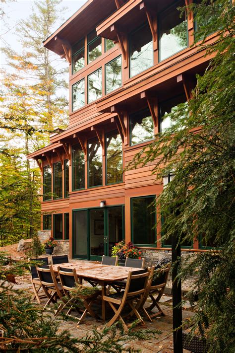 Modern Adirondack Lake House With Wood Siding Green Trim And Full View