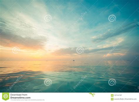 Calm Sea Or Ocean And Colorful Sunset Or Sunrise Sky Background