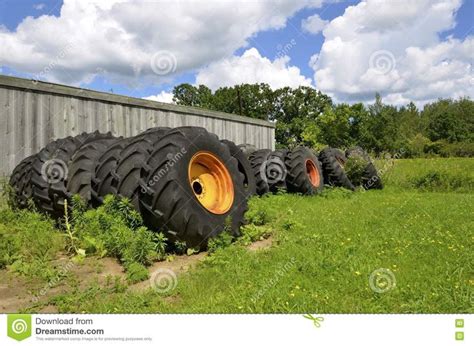 Old Tractor Tires Stacked Against Old Building Download From Over 60