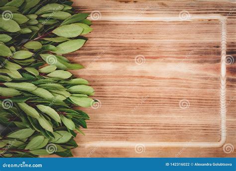Green Leaves On Wood Table Stock Photo Image Of Minimal 142316022
