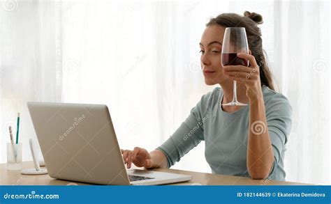 Woman Working On A Laptop With A Glass Of Wine Stock Image Image Of