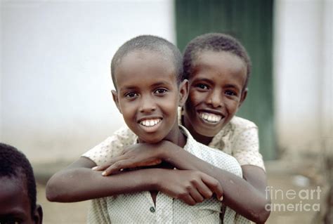 Two Smiling Boys On The Streets Of Mogadishu Somalia Photograph By