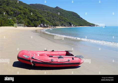Red Inflatable Boat On Beach Turtle Bay Cape Grafton Near Cairns