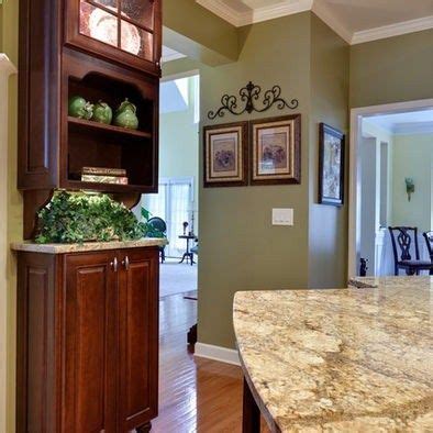 Black cabinets can look modern, elegant or even country if you sand down the edges. Golden oak wood floor with sage green walls. I also like the crown molding. Maybe use this in ...