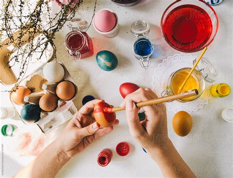 Woman Colouring Easter Eggs By Stocksy Contributor Marija Savic