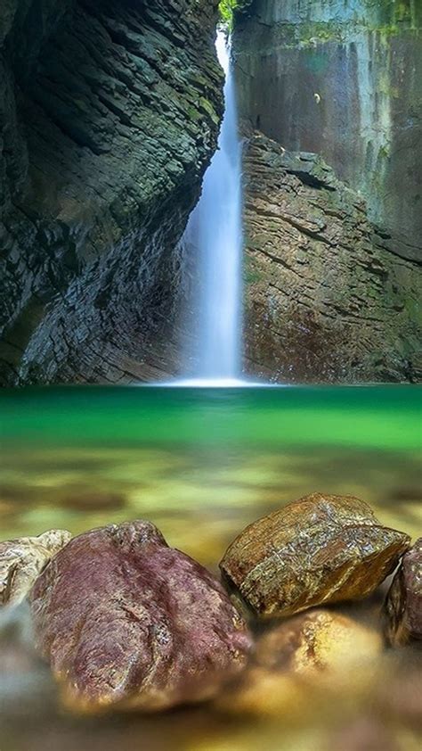 Waterfall Between Cave Rocks Stones On Water 4k Hd Nature Wallpapers