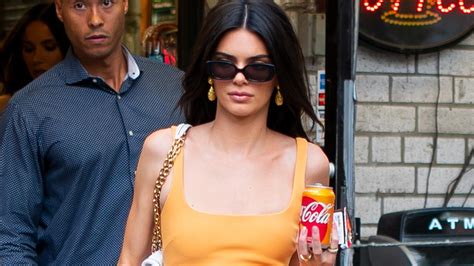 Kendall Jenner Supermodel Poses With Coca Cola Can And Orange Dress In