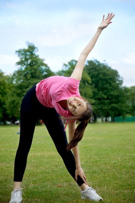 Beautiful Woman Doing Stretching Exercises Outdoors Freestock Photos