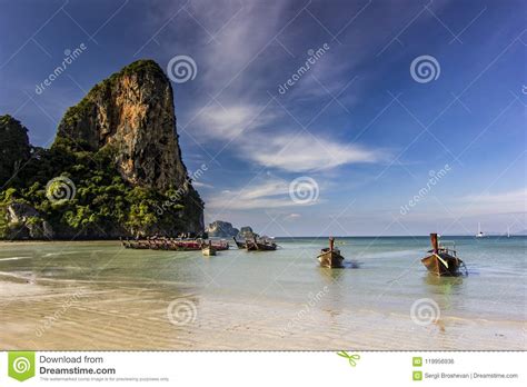 Ocean Seashore With Island And Boat On Water At Sunset In Krabi