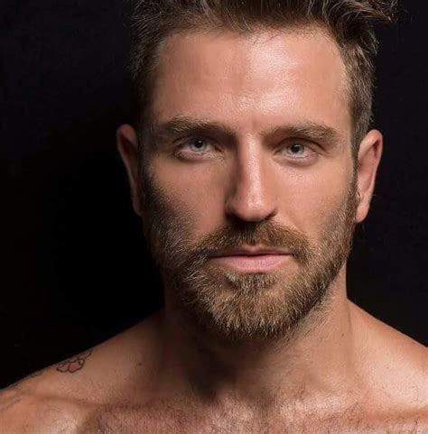 a man with a beard and no shirt on