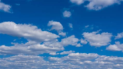 Clouds Against A Vivid Blue Sky Hd 1080p Time Lapse Stock Footage