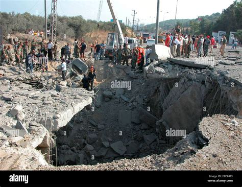 Lebanese Rescuers Soldiers And Citizens Inspect The Destroyed Bridge