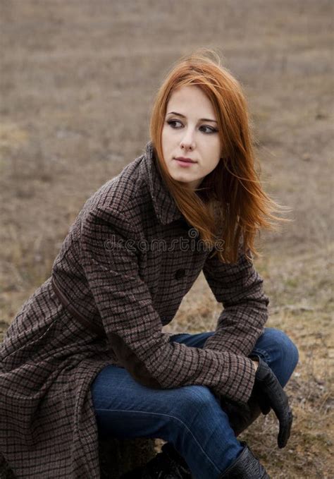 Redhead Girl Sitting At Outdoor In Autumn Time Stock Photo Image Of