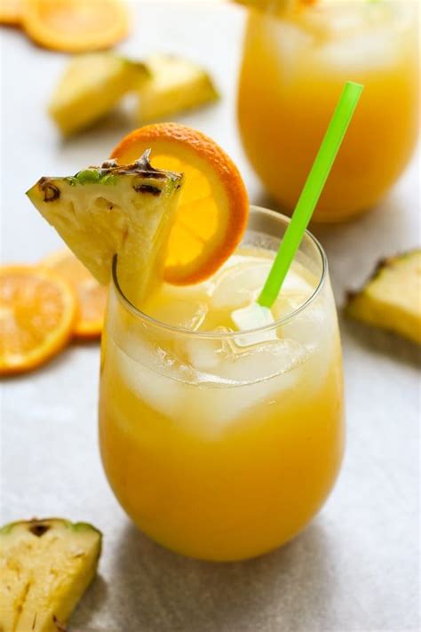 Pineapple And Orange Coconut Rum Cocktail Recipe Coconut Rum Rum Cocktail Recipes Easy