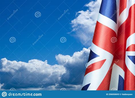 National Flags Of United Kingdom On A Flagpole On Blue Sky Background