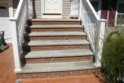 But stepping off the bottom step (or preparing to step up on it) is actually when someone is the most off balance and likely to fall. Masonry steps with limestone, brick veneers, and stamped concrete center landing. | Front porch ...