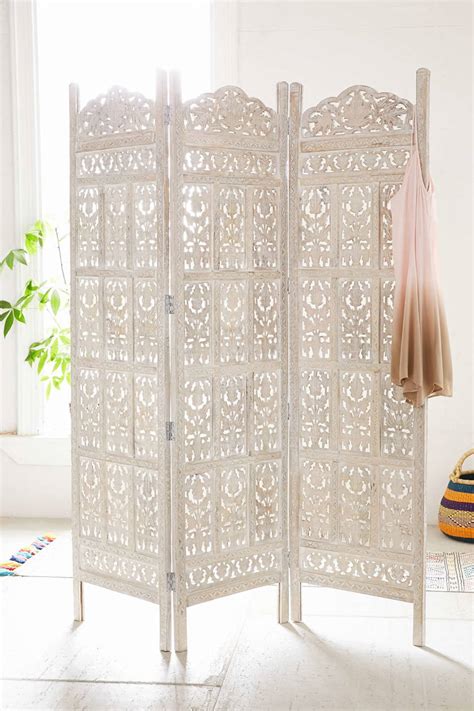 Black laser cut decorative screen to divide the kitchen and the dining zone. 10 Best Room Dividers & Screens to Buy | Apartment Therapy