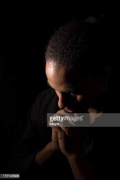 Head Bowed In Prayer Photos And Premium High Res Pictures Getty Images