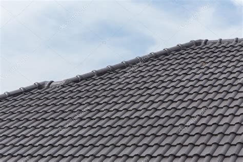 Black Tile Roof On A New House Stock Photo By ©sutichak 80005622