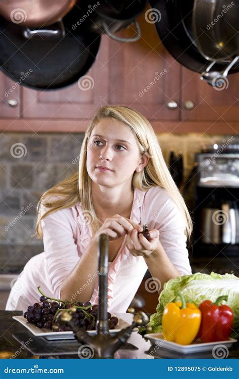 teenage girl leaning on kitchen counter thinking stock image image of girl teenager 12895075
