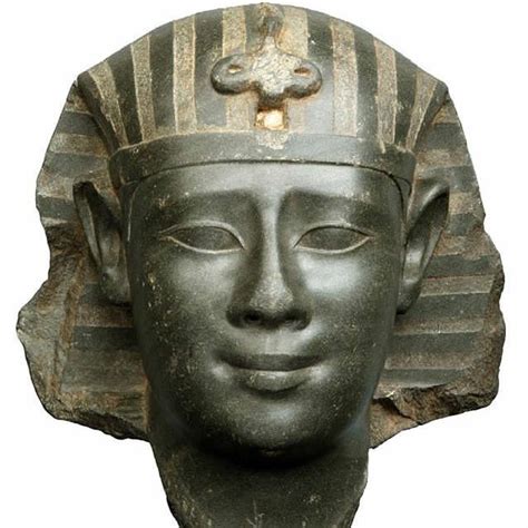 An Ancient Egyptian Head Is Shown Against A White Background