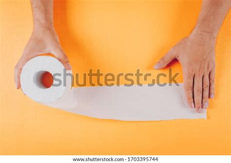 Man Unrolling Toilet Paper Roll Top Stock Photo 1703395744 Shutterstock