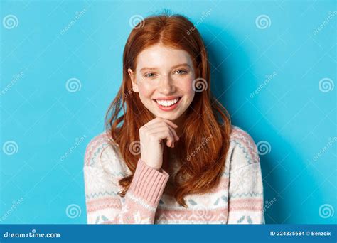 Close Up Of Beautiful Redhead Girl Smiling Having Conversation And Staring At Camera Interested