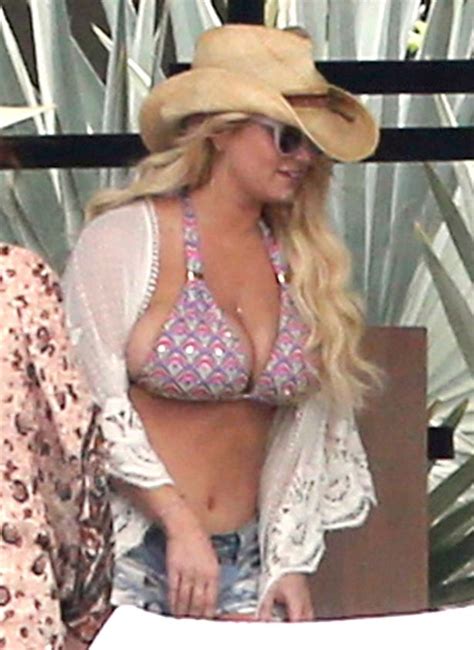Jessica Simpson Squeezes Boobs Into Pink Bikini As She Suns Herself In