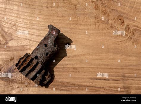 Splinter Of A Mine Of The Period Wwii On Wooden Background Rusty