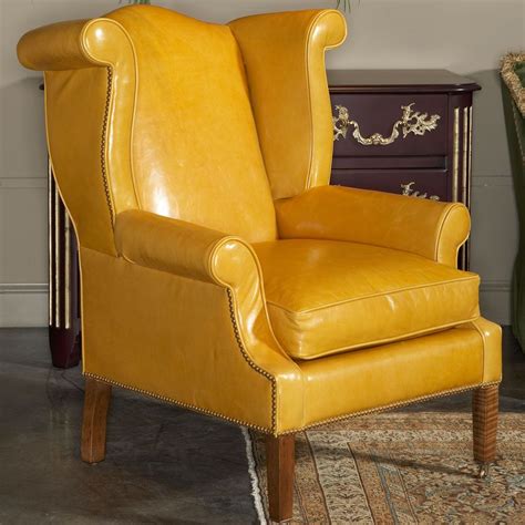 Back legs are moderately carved with a dramatic rake. | Leather wing chair, Wing chair, Wing chair upholstery