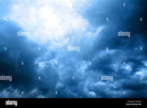 Dark Blue Cloudly Sky With Ray Of Sunlight After Storm Stock Photo Alamy