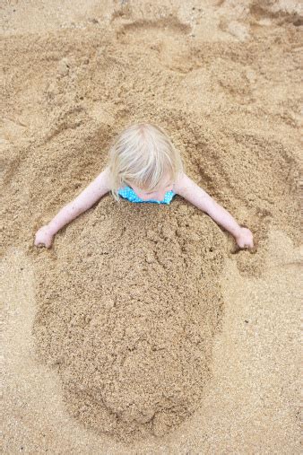 Little Girl Buried In Sand Stock Photo Download Image Now Istock