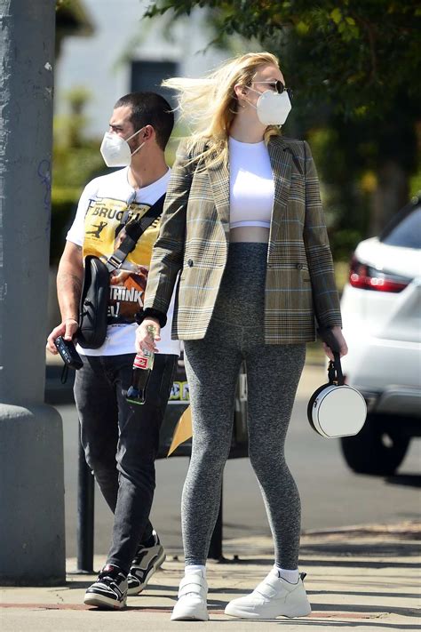 Sophie Turner Shows Off Her Growing Baby Bump In A Crop Top And