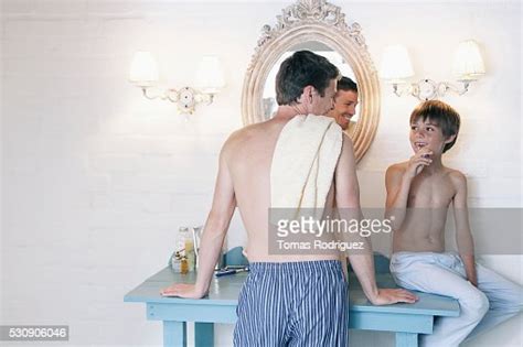 Father And Son In Bathroom Bildbanksbilder Getty Images