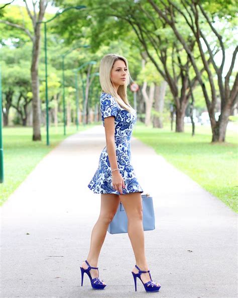 Blonde Cutie Showing Off Her Sexy Legs In A Short Floral