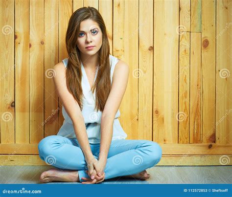 Girl Sitting On A Floor With Crossed Legs Stock Image Image Of