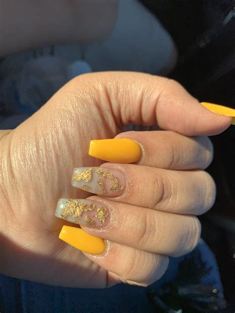Yellow acrylic nails are a must try this year. Yellow nails with gold flakes 💛💛 #coffinnails #goldflakes #yellow | Yellow nails design, Yellow ...