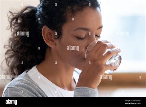 Thirsty African American Woman Drinking Mineral Water Stock Photo Alamy