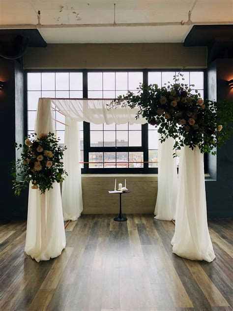 Romantic Chuppah Styled With A Symmetrical Floral Arrangements And