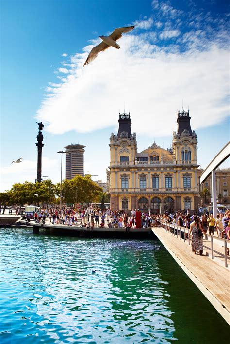 Barcelonas Port Authority Building With The Columbus Monument To The