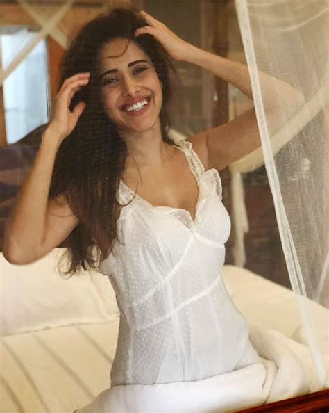 Nushrat Bharucha Goes Sultry In White Dress As She Strikes Poses On Bed